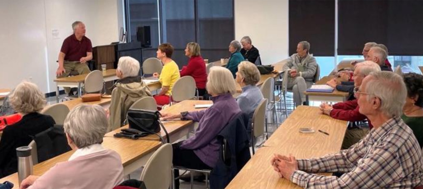 Terry McAteer teaching a full classroom in the Sierra College OLLI Program