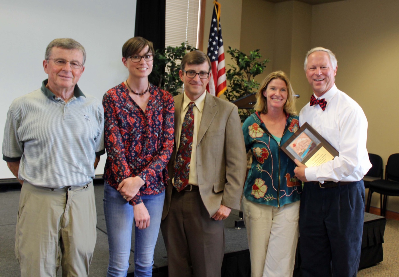 Terry McAteer receiving an award for his contributions to education as outgoing Superintendent of Schools
